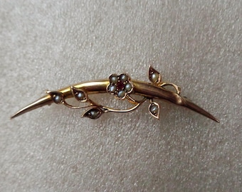 Gold honeymoon crescent brooch with seed pearls and red gemstone