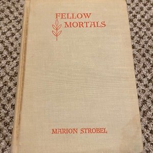 May include: A vintage book titled "Fellow Mortals" by Marion Strobel. The book cover is a light beige color with red lettering and a stylized plant illustration.