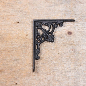 Black decorative cast iron shelf bracket with flower pattern DG3
