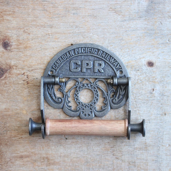 Canadian Railway Toilet Paper Holder with a vintage iron finish.