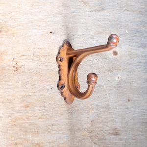 Cast iron harness designed hook with a rust finish look, Heavy cast iron Coat Hook