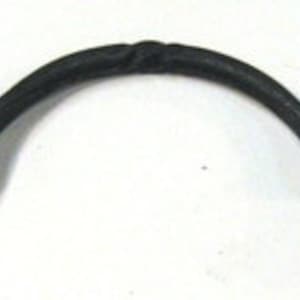 May include: Black metal handle with a twisted design. The handle is curved and has a rounded shape at each end.