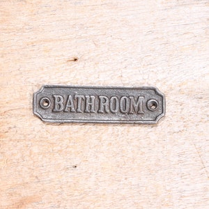 Vintage looking Cast iron Bathroom sign plate.