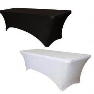 May include: Two fitted tablecloths, one black and one white. The tablecloths are made of a stretchy fabric and fit snugly over a rectangular table.