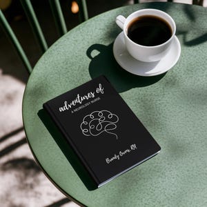 May include: A black book with the title "adventures of a neurology nurse" and a white line drawing of a brain. The author's name is Brandy Owens, RN.