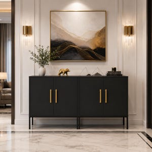 May include: A black cabinet with gold handles and legs, featuring four doors. The cabinet is adorned with decorative items, including a gold bear figurine, geometric sculptures, and books. A large abstract painting hangs above the cabinet, and the room is illuminated by wall sconces.
