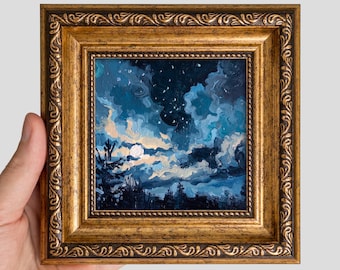 May include: A square oil painting in an ornate, antique gold-toned frame featuring a night sky with a bright moon, swirling blue and white clouds, and dark silhouettes of pine trees at the bottom, rendered with visible, textured brushstrokes.