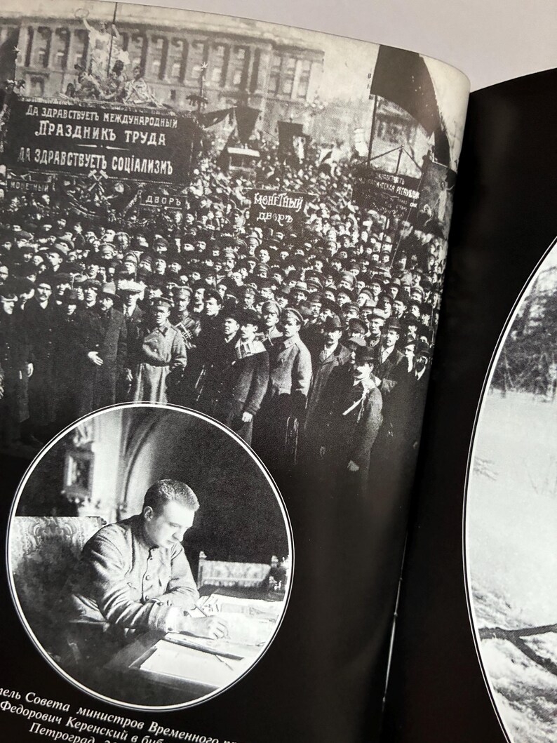 May include: A black and white photograph from a book depicting a large crowd of people in front of a building, with banners in Cyrillic script. A circular inset shows a man seated at a desk. The image is a historical document.