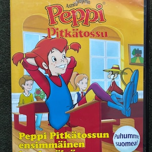 May include: DVD case featuring the animated character Peppi Pitk&auml;tossu, with text in Finnish. The cover art shows Peppi in a classroom setting, with other cartoon characters. The title "Peppi Pitk&auml;tossun ensimm&auml;inen koulup&auml;iv&auml;" is displayed.