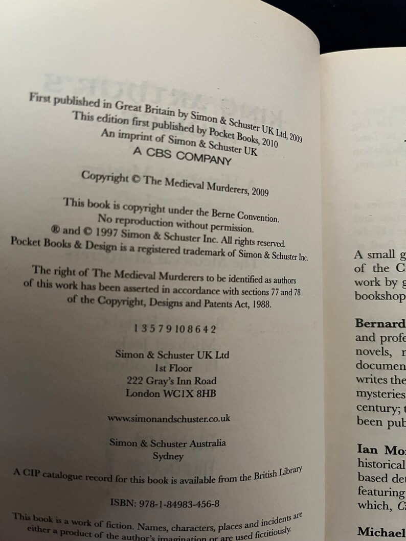 May include: An open book page displaying text from "The Medieval Murderers" by Simon & Schuster. The page includes copyright details, ISBN, and publisher information. Black text on a white page.
