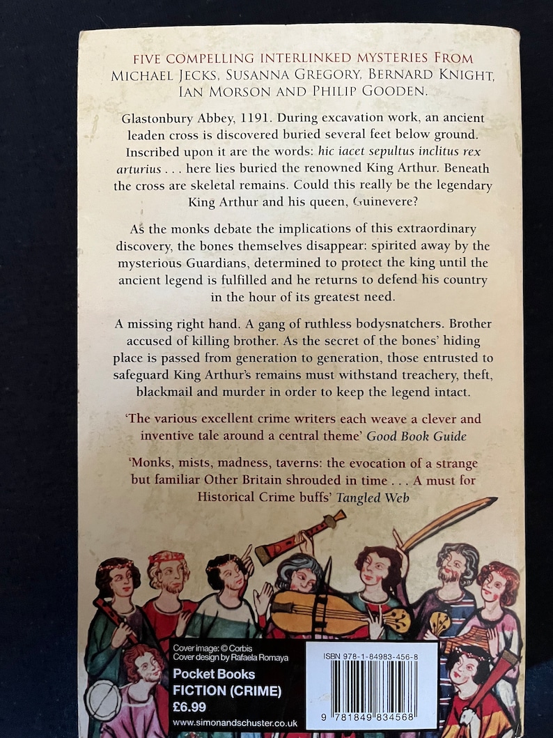 May include: A Pocket Books crime fiction novel's back cover, featuring a medieval illustration. The cover displays text including author names, a synopsis, and the price of &pound;6.99. The ISBN is also visible.