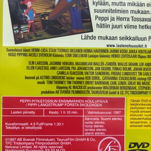 May include: DVD case for "Pippi Longstocking's First Day of School." The cover features cartoon illustrations of Pippi Longstocking, a man, and a monkey. The DVD case is red and has text in Finnish.