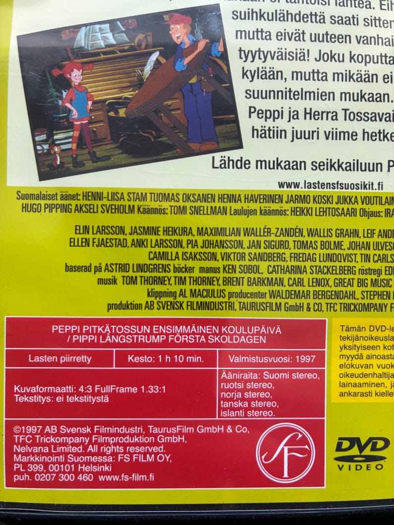 May include: DVD case for "Pippi Longstocking's First Day of School." The cover features cartoon illustrations of Pippi Longstocking, a man, and a monkey. The DVD case is red and has text in Finnish.