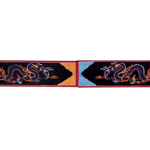 May include: Two black fabric panels with red borders, each featuring a purple dragon with orange flames and colorful jewels. The panels have gold and blue accents.