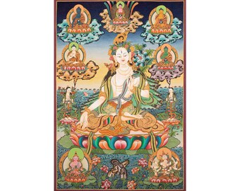 May include: A colorful Tibetan Buddhist painting depicting a deity surrounded by smaller figures. The central figure is a white-skinned female deity with a green robe, sitting on a lotus flower. The painting is filled with intricate details and vibrant colors.