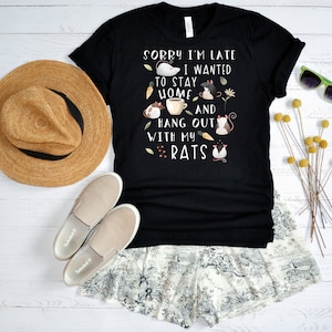 May include: Black t-shirt with a graphic of rats and the text "Sorry I'm late I wanted to stay home and hang out with my rats".
