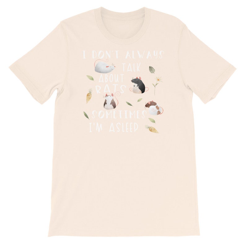 May include: A beige t-shirt with the text "I don't always talk about rats, sometimes I'm asleep" in white. The shirt features a cartoon illustration of four rats in different poses.