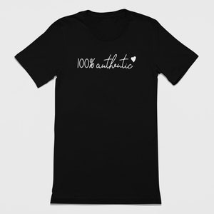May include: Black t-shirt with white text that reads "100% authentic" and a small white heart.