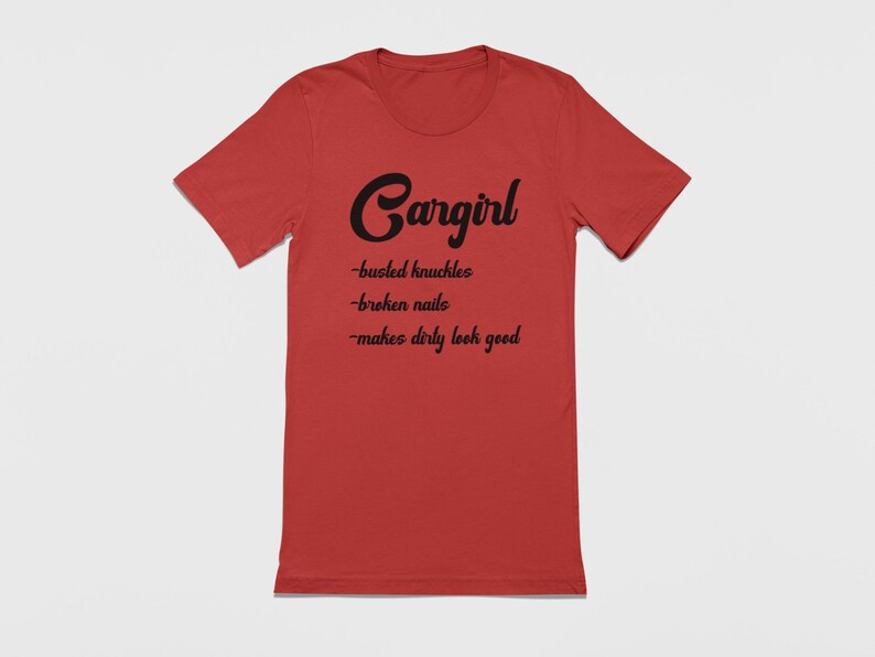 May include: Red t-shirt with black text that reads "Cargirl - busted knuckles - broken nails - makes dirty look good"