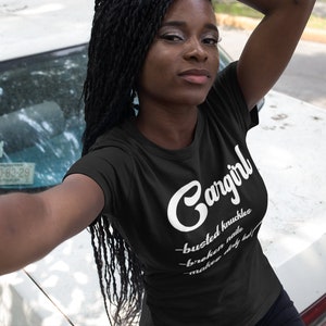May include: Black t-shirt with white text that reads "Gangirl - busted knuckles - broken nails - make dirty look good".