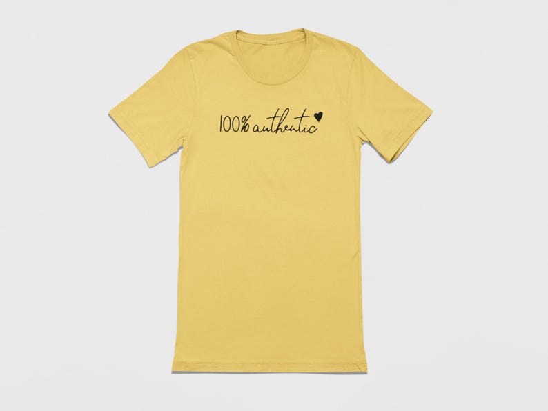 May include: A yellow t-shirt with the text "100% authentic" and a small heart.