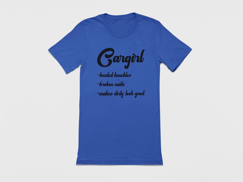 May include: A royal blue t-shirt with black text that reads "Cargirl - busted knuckles - broken nails - makes dirty look good".