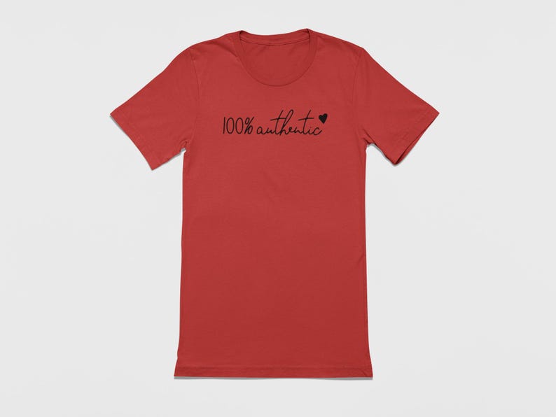 May include: A red t-shirt with the text "100% authentic" and a small heart symbol printed on the front.