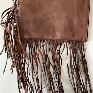 Handmade genuine organic soft clutch bag with Tusels with a pocket inside