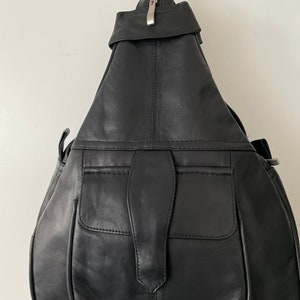 Genuine organic soft leather backpack and shoulder bag one front one back and one inside pocket