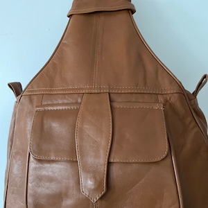 Genuine organic soft leather backpack and shoulder bag one front one back and one inside pocket