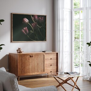 May include: A framed print of a bouquet of pink tulips against a dark green background. The tulips are in focus, while the background is blurred.