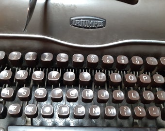 The Triumph Norm is a portable typewriter that was produced in Germany in 1957.