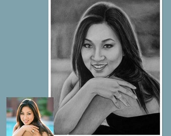 May include: A black and white pencil drawing of a woman with long dark hair. She is wearing a black strapless dress and has a ring on her finger.