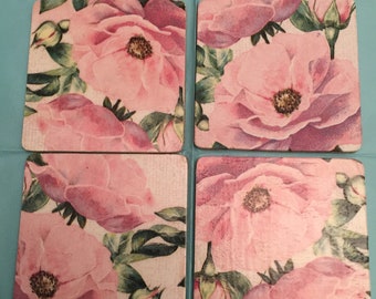 A set of 4 pink wild roses wooden coasters