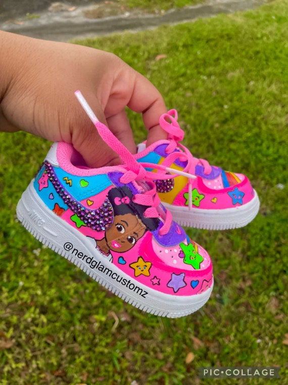Pink kids nike shoes 2025