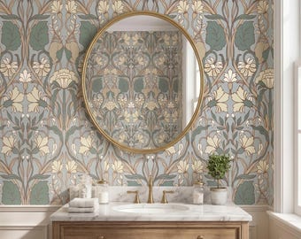May include: A bathroom with a floral wallpaper design in shades of blue, green, and cream. A gold-framed round mirror hangs above a wooden vanity with a marble countertop. The vanity has a sink, faucet, and various toiletries.