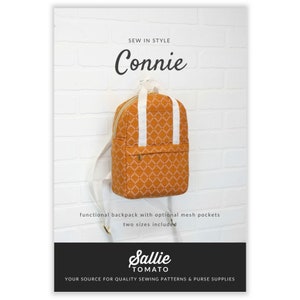 May include: A brown and white patterned backpack with white straps and a gold zipper. The backpack is hanging on a white brick wall. The text "SEW IN STYLE Connie" is at the top of the image. The text "functional backpack with optional mesh pockets two sizes included" is below the backpack. The text "Sallie TOMATO YOUR SOURCE FOR QUALITY SEWING PATTERNS & PURSE SUPPLIES" is at the bottom of the image.