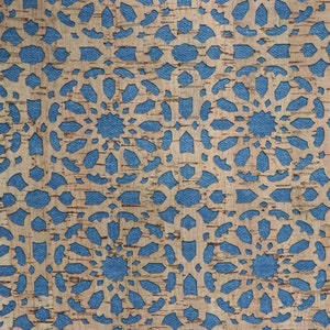 May include: A corkboard with a blue patterned design cut out of the cork. The pattern is a repeating design of flowers.