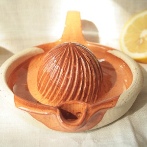 Turned stoneware ceramic citrus squeezer for lemons and oranges