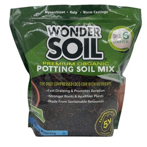 May include: A green bag of Wonder Soil Premium Organic Potting Soil Mix. The bag features a large black and white logo with the text "Wonder Soil". The bag also features the text "The only compressed coco coir with nutrients" and a list of benefits: "Fast Draining & Promotes Aeration", "Stronger Roots & Healthier Plants", and "Made From Sustainable Resources".