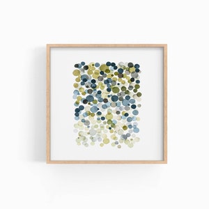 May include: A framed abstract art print featuring a cluster of blue, green, and white circles on a white background.