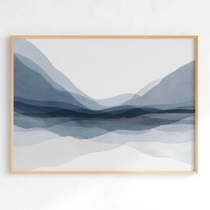 May include: Abstract watercolour painting of blue and grey mountains in a wooden frame.