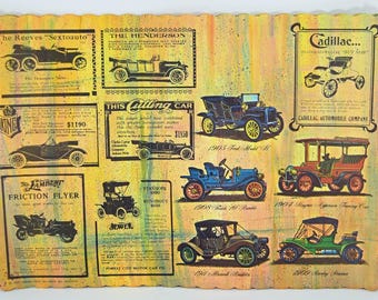 May include: Vintage poster featuring various antique cars, including models from Cadillac, Ford, and Henderson. The poster has a distressed, aged appearance with text and illustrations of the vehicles. The color palette includes yellow, brown, and blue.