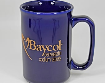 Baycol Cerivastatin teruggeroepen. Promotieartikel van een farmaceutisch vertegenwoordiger: reclame voor een koffiemok (zeldzaam).