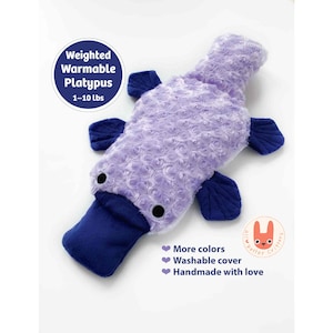 May include: A weighted warmable platypus plush toy with a lavender rose-patterned textured body and dark blue bill, feet, and tail. Text reads: Weighted Warmable Platypus 1-10 lbs, More colors, Washable cover, Handmade with love, and all better critters.