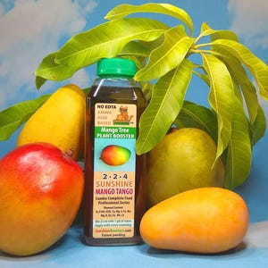 May include: A brown bottle of Mango Tree Plant Booster 2-2-4 Sunshine Mango Tango Combo Complete Feed Professional Series. The bottle is surrounded by four mangoes, two yellow, one green, and one red and yellow.