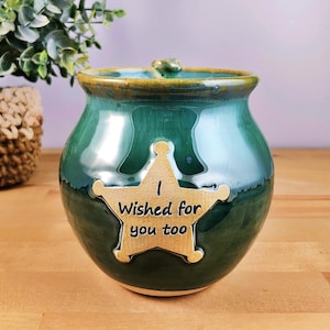 May include: Green ceramic mug with a gold star and the text "I wished for you too".