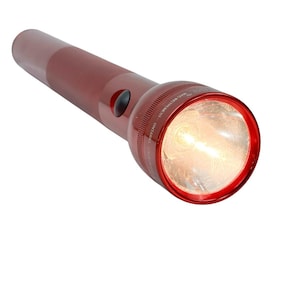 May include: A maroon flashlight with a bright light emanating from the front. The flashlight has a cylindrical body with a black button and a red bezel around the lens. The brand name is visible on the bezel.