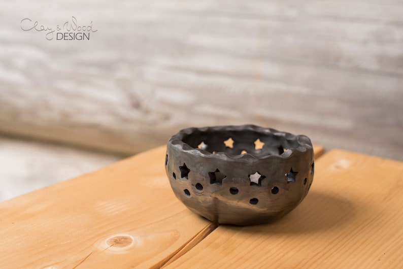 Black ceramic candle holder with holes in shape of stars and Etsy