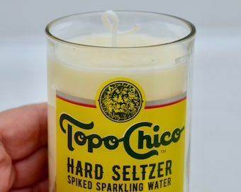 Topo Chico Hard Seltzer fles met granaatappel Prosecco sojakaars